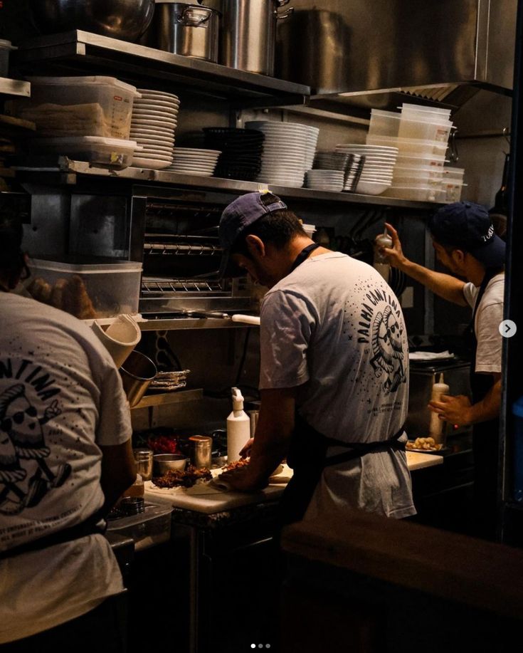 Kitchen team plating dishes during a busy shift
